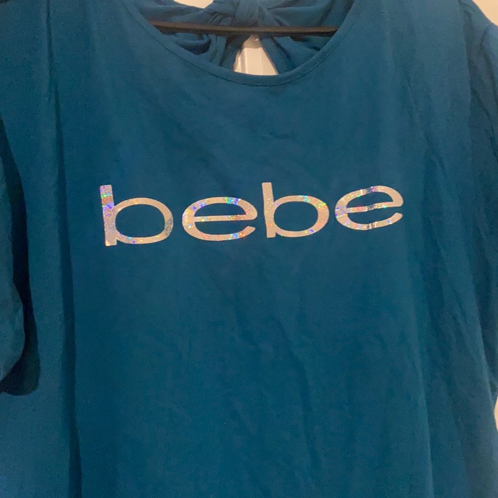 Brand New Bebe Dress. Knee length depending on height Never worn